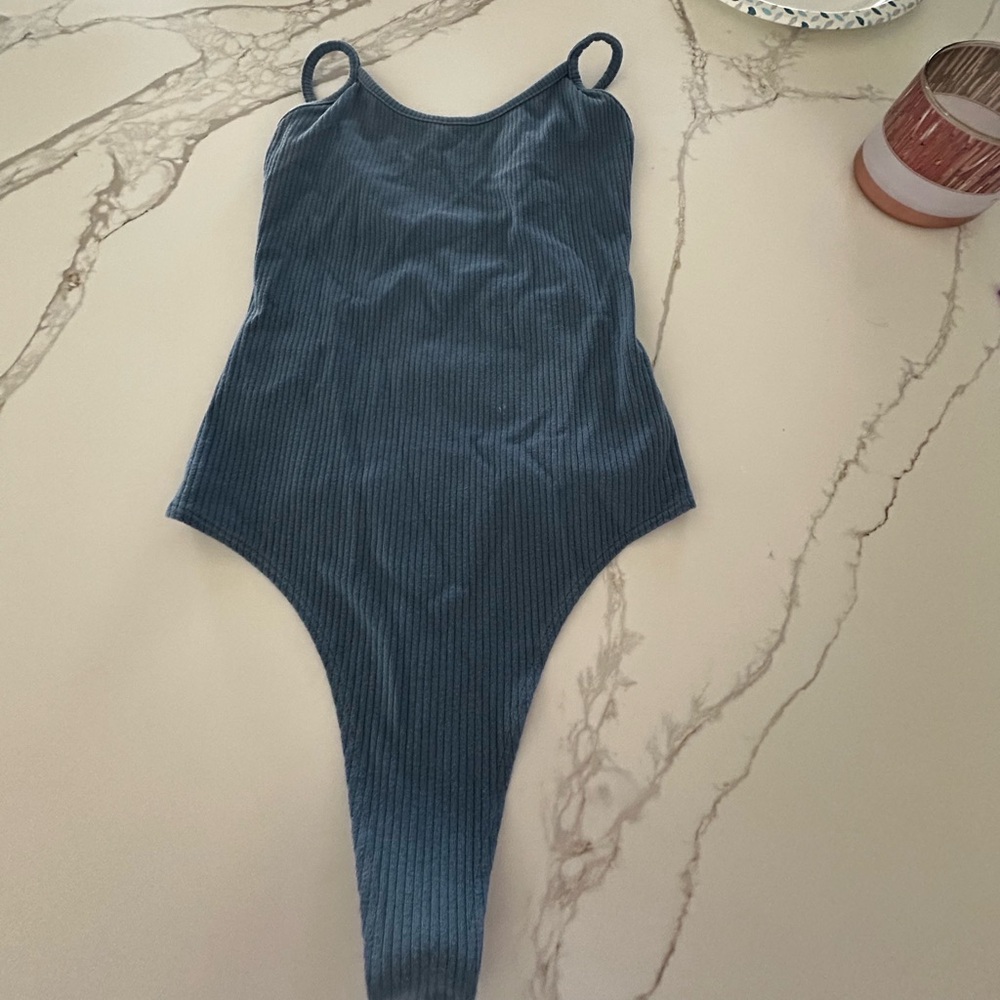 Women’s blue body suit